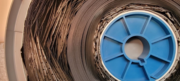 Closeup of film reel with warp and curl